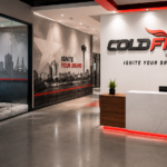 Modern branded office lobby featuring Cold Fire Signs dimensional logo, San Antonio wall mural, glass conference room graphics, wayfinding signs, and custom interior branding.