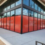 Custom window graphics printed with Canon Colorado UVgel technology featuring banners, vehicle graphics, window film, and white ink applications by Cold Fire Signs in San Antonio.